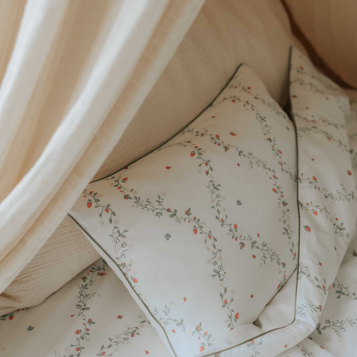 Botanical Berries Toddler pillow in bed