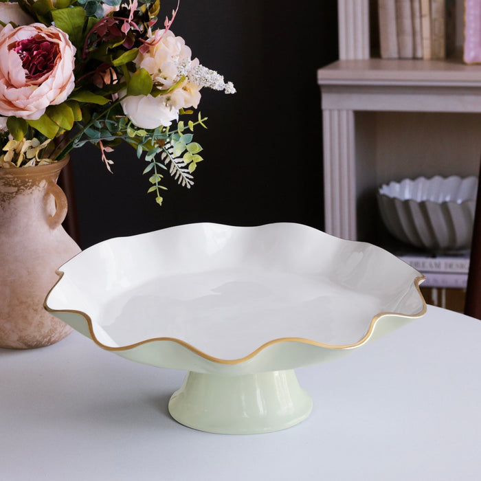 Beatriz Ball Encanto Carola Pedestal Cake Plate — Empty beside a floral arrangement