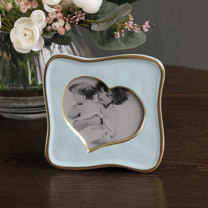 Beatriz Ball Frame Encanto Curved Heart 5 x 5 — Beside a floral arrangement