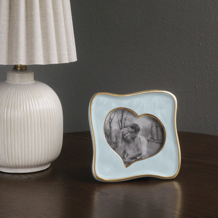 Beatriz Ball Frame Encanto Curved Heart 5 x 5 — Beside a white lamp