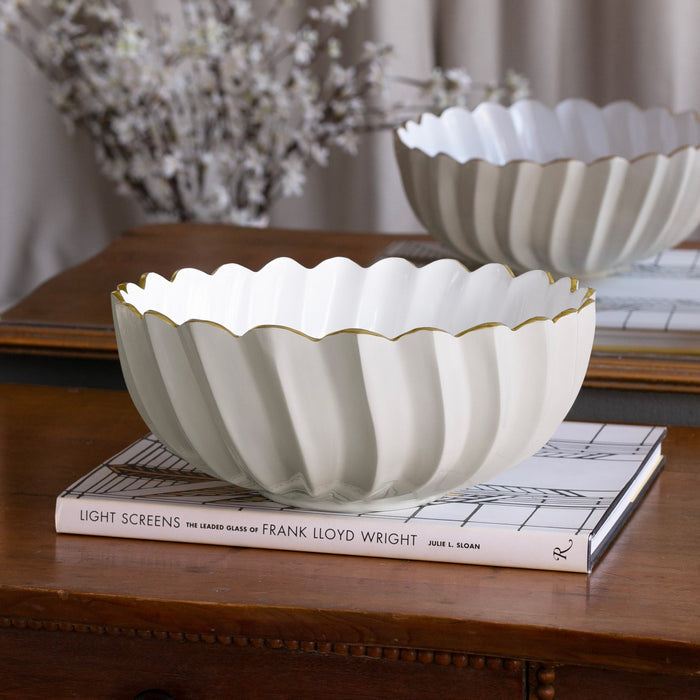 Beatriz Ball Encanto Orlando Medium Bowl — Empty bowl on books beside a vase