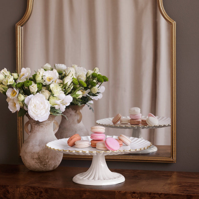Beatriz Ball Encanto Vienna Pedestal Cake Plate — With small desserts and a flower arrangement