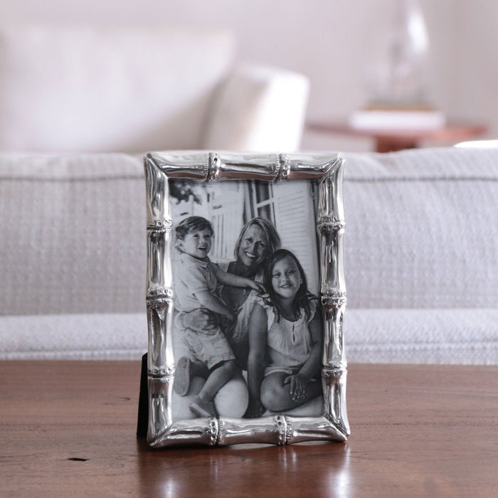 Beatriz Ball Giftables Garden Bamboo 4 x 6 Frame — Standing on a pale bedside surface
