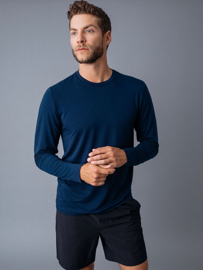 Joe is 6'2, 177LBS and wears a size L # Navy Performance Long Sleeve Tee | Fresh Clean Threads