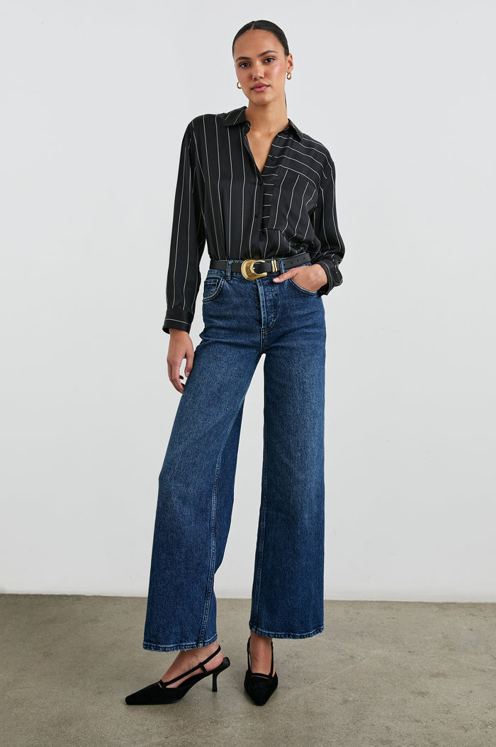 Spencer Long-Sleeve Button Up with Chest Patch Pocket in Ink Stripe Colorway, Thin White mixed vertical and horizontal stripes on Black - Front Tucked Full Body View Featured on Model