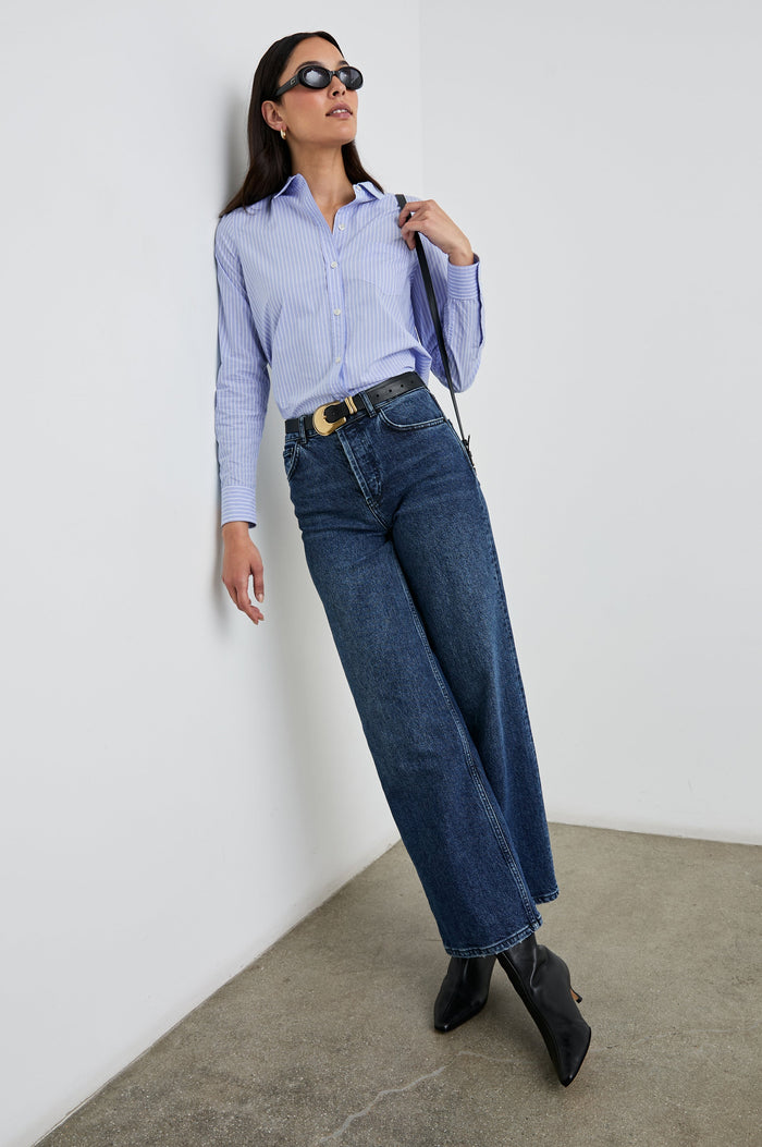 Stina Long-Sleeve Button Up with a Chest Patch Pocket in Oxford White Stripe Colorway, Thin White Vertical Stripes on Blue - Front Tucked Full Body View Featured on Model