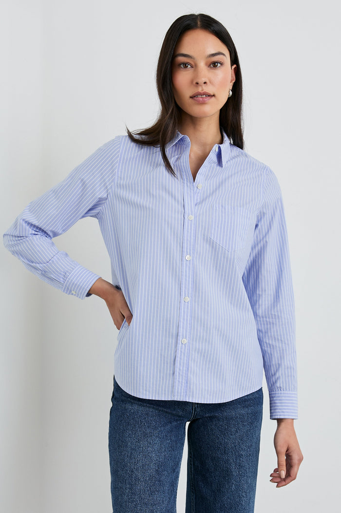 Stina Long-Sleeve Button Up with a Chest Patch Pocket in Oxford White Stripe Colorway, Thin White Vertical Stripes on Blue - Front View Featured on Model