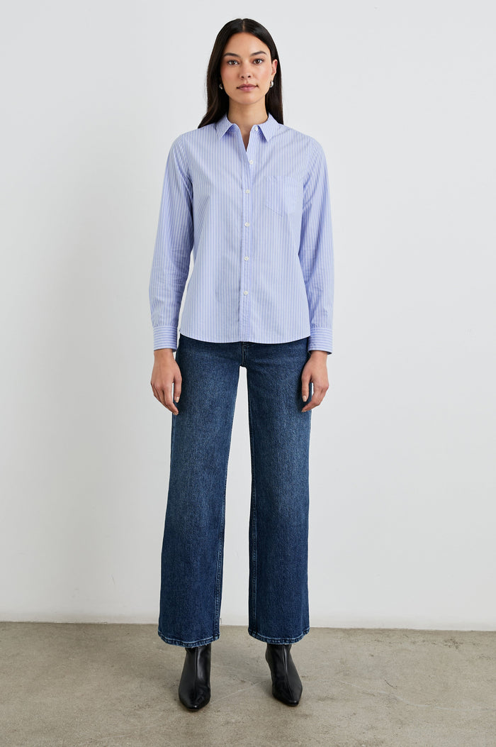 Stina Long-Sleeve Button Up with a Chest Patch Pocket in Oxford White Stripe Colorway, Thin White Vertical Stripes on Blue - Front Full Body View Featured on Model